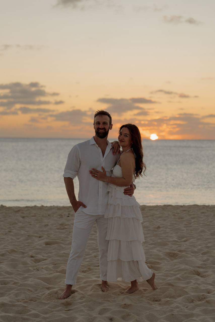 Seth and Bailey on the beach at sunset